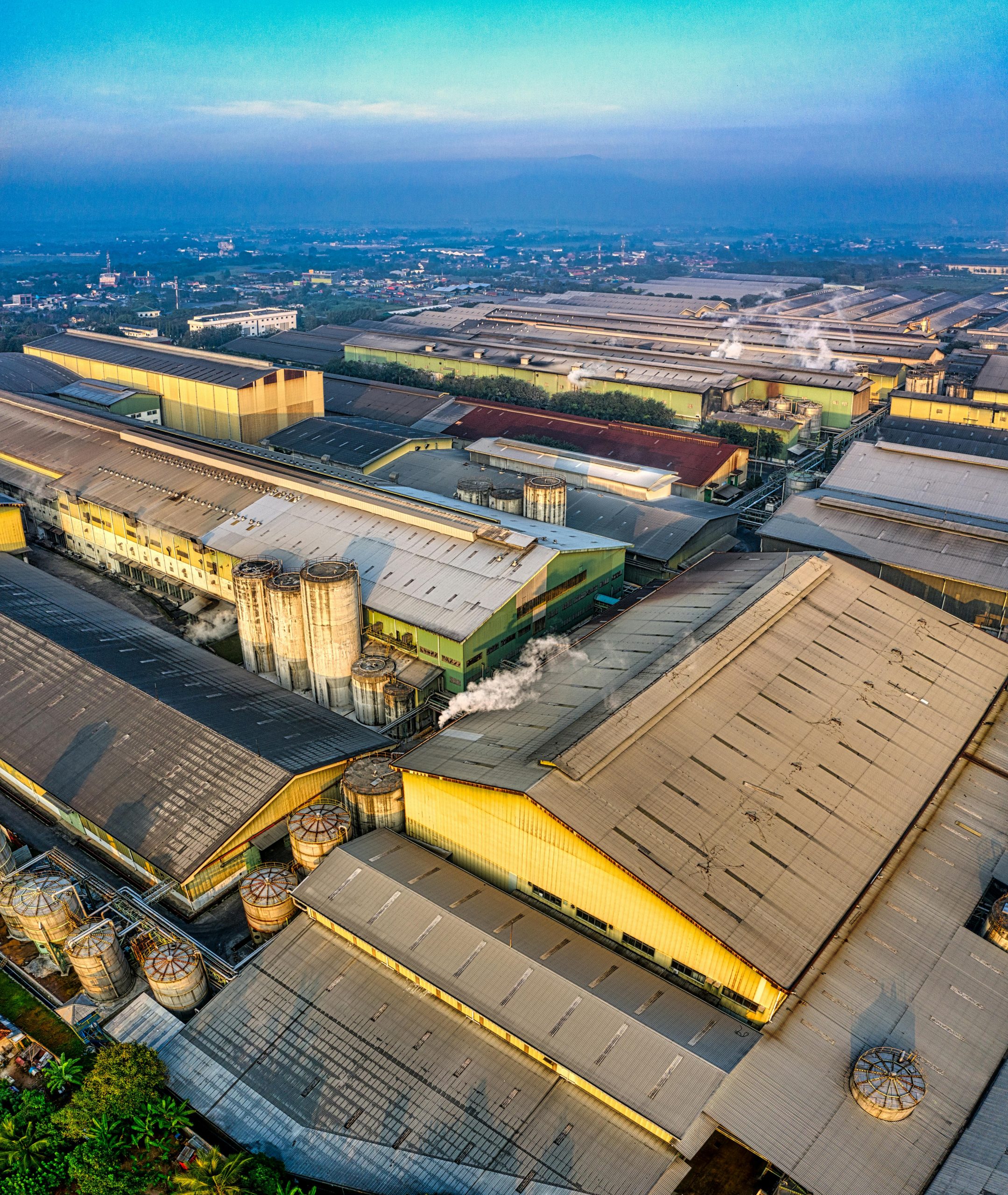 Aerial view of expansive industrial warehouses in Serang, Banten, showcasing urban infrastructure.